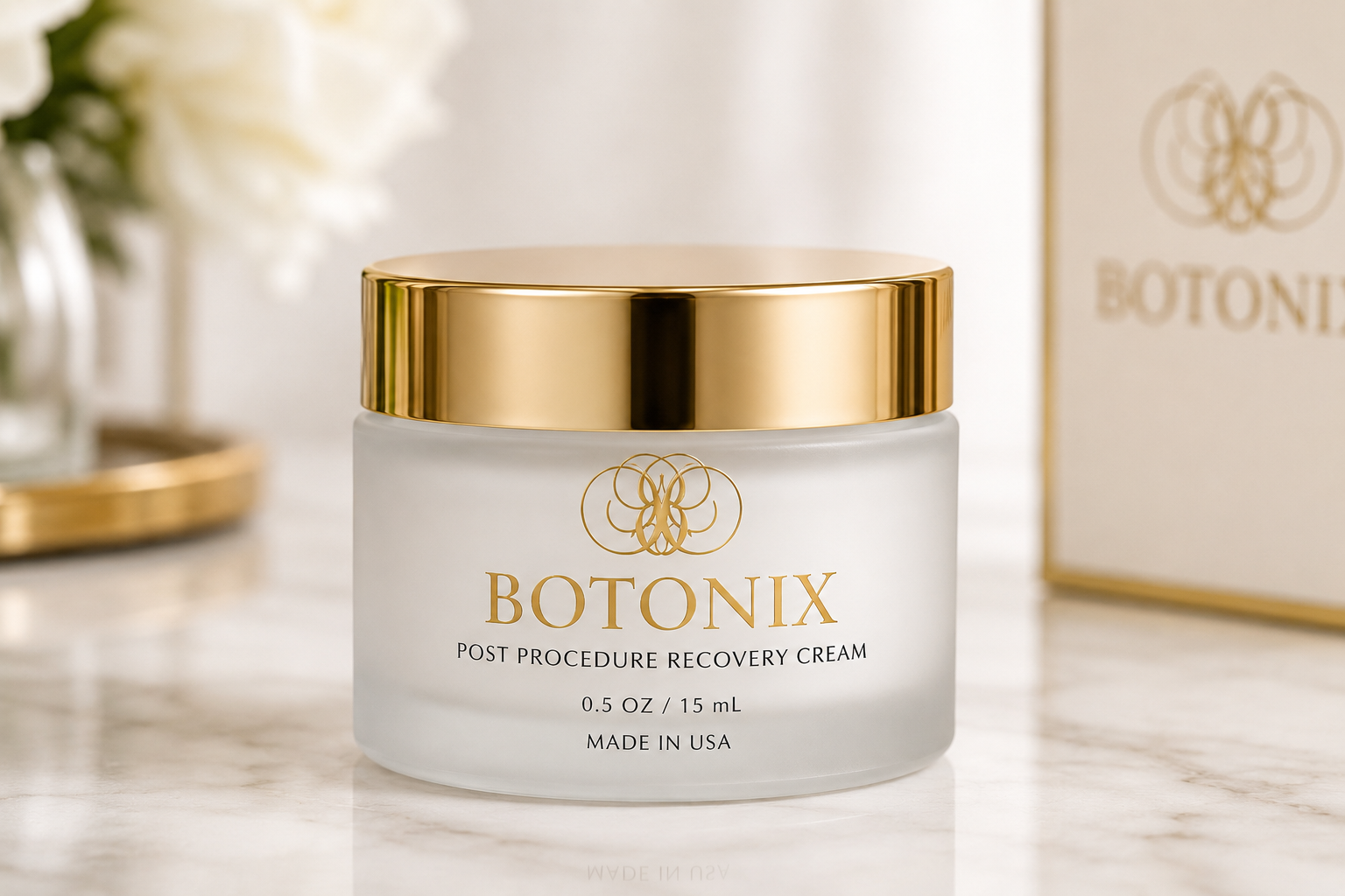 BOTONIX Post Procedure Recovery Cream jar in frosted glass with gold lid on marble countertop